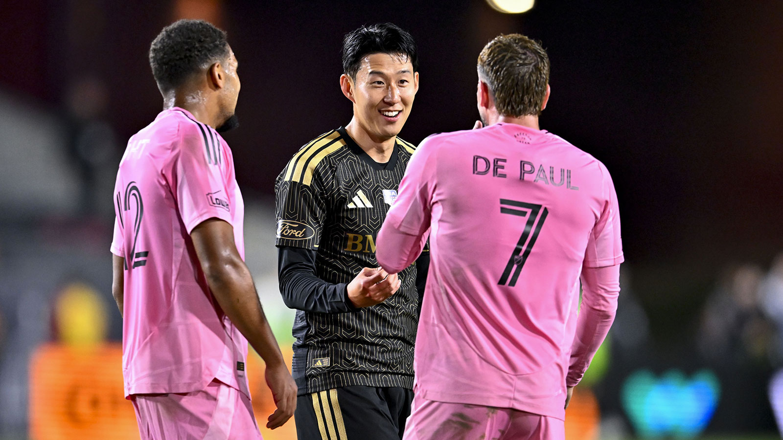 Los Angeles FC forward Son Heung-Min (7) talks with Inter Miami CF midfielder Rodrigo De Paul (7) and midfielder David Ruiz (12) during the first half at Los Angeles Memorial Coliseum.