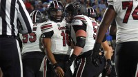 South Carolina Gamecocks quarterback LaNorris Sellers (16) reacts with offensive lineman Boaz Stanley (50) after a touchdown during the first quarter at Vaught-Hemingway Stadium.