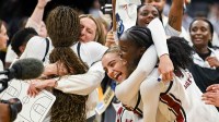South Carolina Gamecocks guard Tessa Johnson (5) and guard Agot Makeer (44) celebrate after defeating the Texas Christian University Horned Frogs in an Elite Eight game in the Sacramento Regional 4 of the women's 2026 NCAA Tournament.