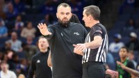 South Florida Bulls head coach Bryan Hodgson talks to a referee during the second half against the Memphis Tigers at FedExForum.