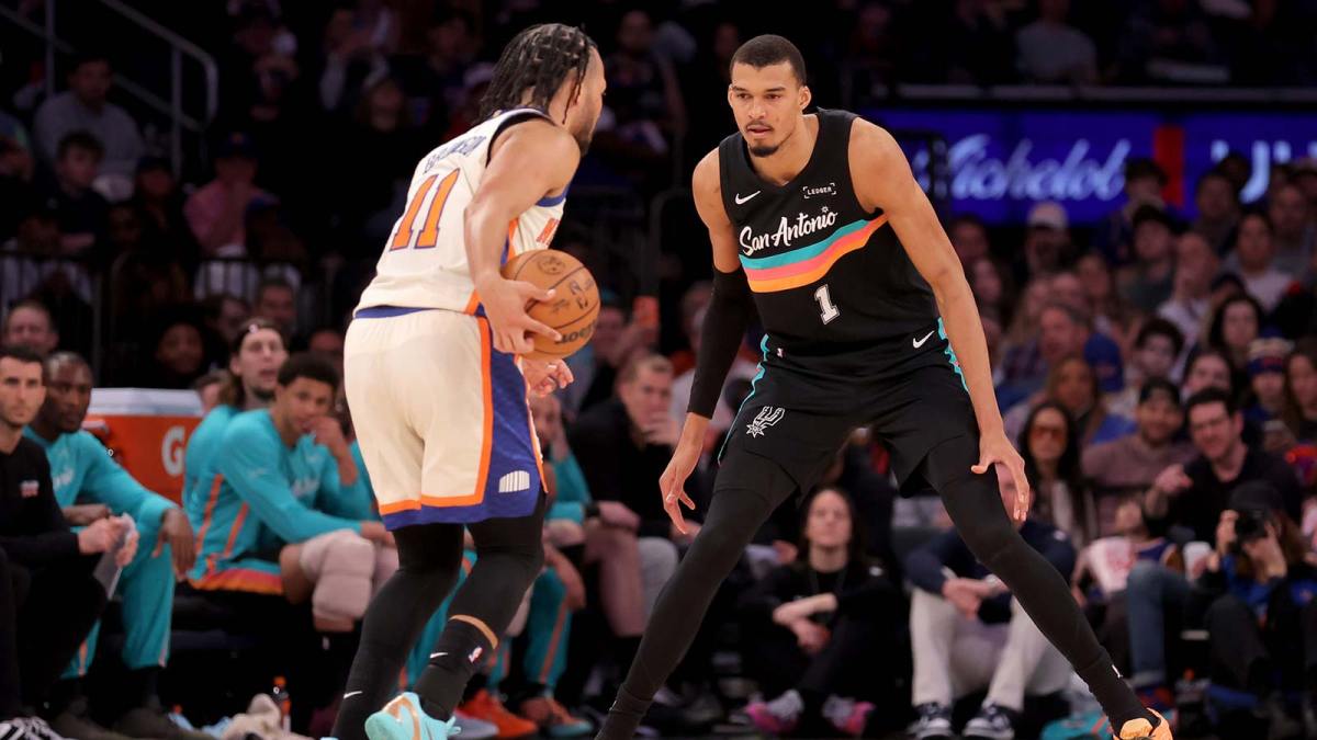 San Antonio Spurs forward Victor Wembanyama (1) defends New York Knicks guard Jalen Brunson (11) during the third quarter at Madison Square Garden.