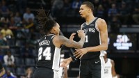 San Antonio Spurs forward Victor Wembanyama (1) and guard Devin Vassell (24) react during the third quarter against the Memphis Grizzlies at FedExForum.