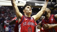 St. John's Red Storm guard Dylan Darling (0) celebrates after defeating the Kansas Jayhawks in a second round game of the men's 2026 NCAA Tournament at Viejas Arena.