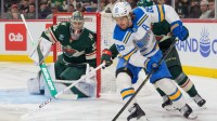 St. Louis Blues center Robert Thomas (18) attempts a wrap around on Minnesota Wild goaltender Filip Gustavsson (32) in the third period at Grand Casino Arena