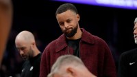 Golden State Warriors guard Stephen Curry (30) stands near the team bench during a timeout against the Minnesota Timberwolves in the third quarter at the Chase Center.