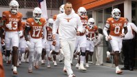 Texas Longhorns head coach Steve Sarkisian leads his team on to the field before a game against the Vanderbilt Commodores at Darrell K Royal-Texas Memorial Stadium.