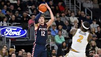 Penn Quakers forward TJ Power (12) shoots the ball over Providence Friars guard Jaylin Sellers (2) during the second half at Amica Mutual Pavilion.