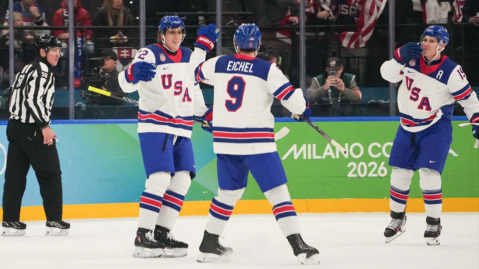 Tage Thompson (72) of the United States celebrates with Jack Eichel (9) of the United States after scoring a goal during the first period against Slovakia in a men's ice hockey semifinal during the Milano Cortina 2026 Olympic Winter Games at Milano Santagiulia Ice Hockey Arena.