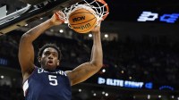 UConn Huskies forward Tarris Reed Jr. (5) dunks the ball against the Duke Blue Devils in the second half during an Elite Eight game of the East Regional of the men's 2026 NCAA Tournament at Capital One Arena.