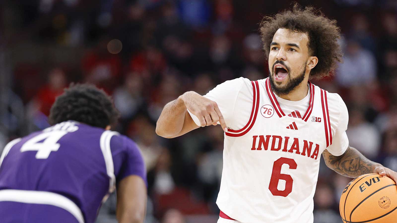Indiana Hoosiers guard Tayton Conerway (6) brings the ball up court against Northwestern Wildcats guard Jayden Reid (4) during the second half at United Center.