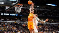 Tennessee guard Ja'Kobi Gillespie (0) dunks on Michigan forward Yaxel Lendeborg (23) during a NCAA Tournament Elite 8 game between Tennessee and Michigan at the United Center in Chicago on March 29, 2026.