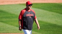 Cincinnati Reds manager Terry Francona (77) returns to the dugout from the pitchers mound in the fifth inning of a Cactus League game between the Cincinnati Reds and Seattle Mariners, Sunday, Feb. 22, 2026, at Goodyear Ballpark in Goodyear, Ariz.