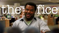 Craig Robinson as Darryl Philbin in NBC's hit sitcom series, The Office, with Dunder Mifflin in background.