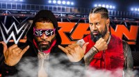 WWE tag team the Usos (Jey and Jimmy), who have debuted new entrance music, with Monday Night RAW at Madison Square Garden MSG background.