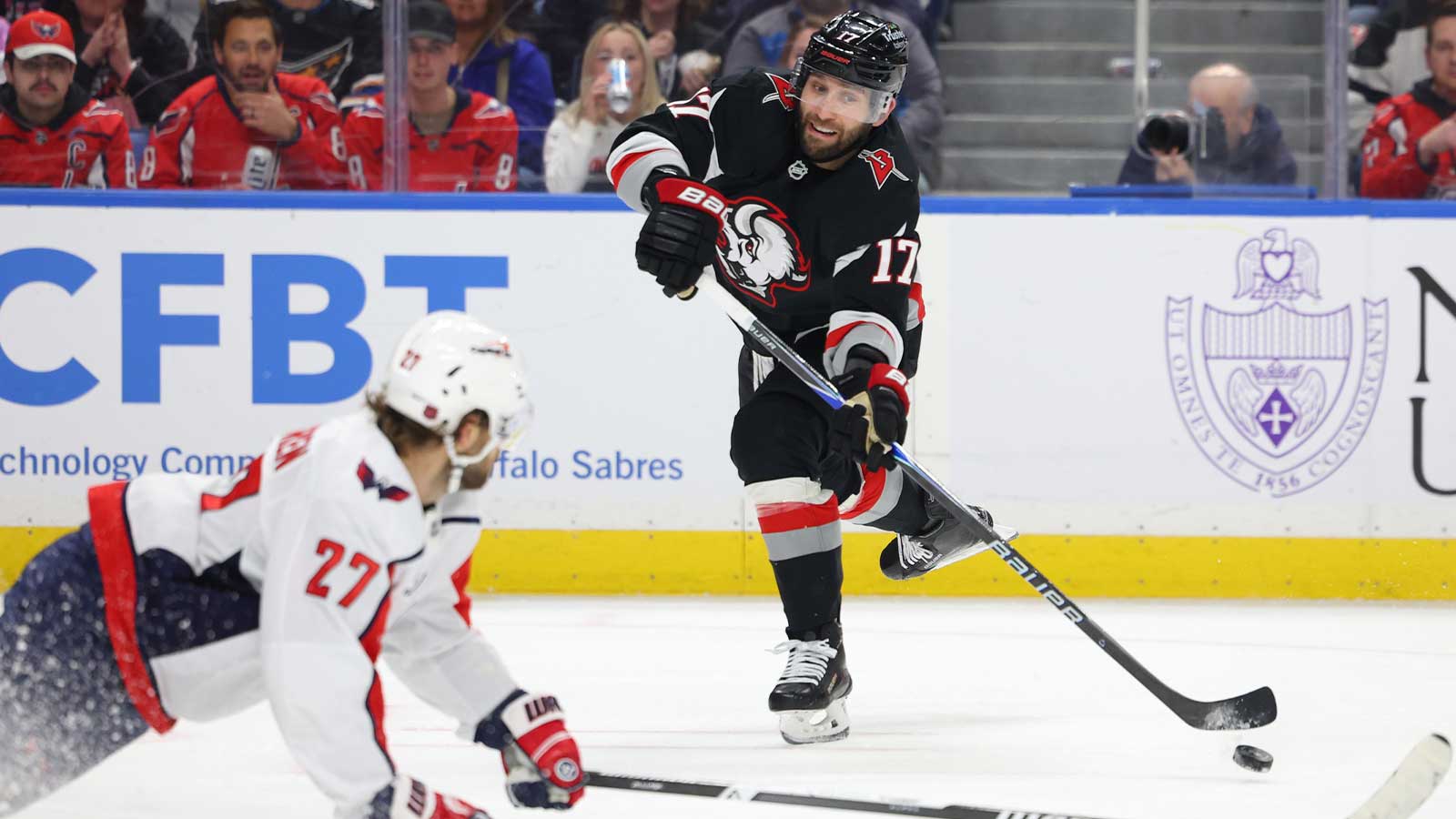Washington Capitals defenseman Timothy Liljegren (27) tries to block a shot by Buffalo Sabres left wing Jason Zucker (17) during the second period at KeyBank Center.