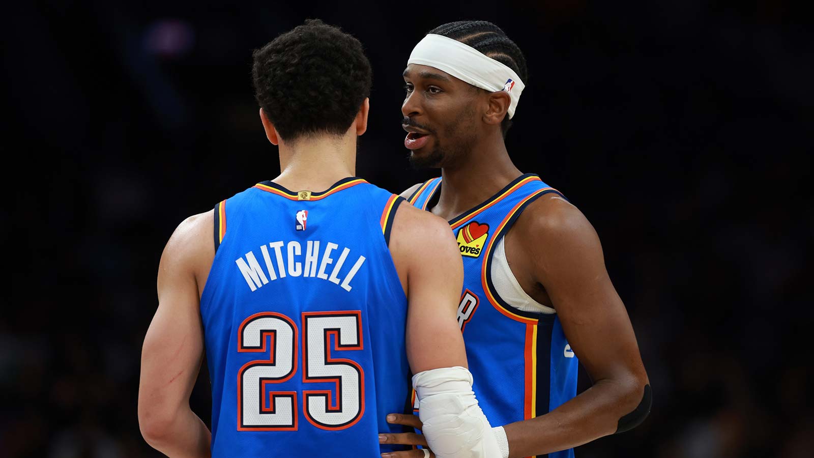 Thunder guard Shai Gilgeous-Alexander (2) with guard Ajay Mitchell (25) against the Phoenix Suns at Mortgage Matchup Center