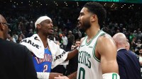 Thunder guard Shai Gilgeous-Alexander (2) talks with Boston Celtics forward Jayson Tatum (0) after their game at TD Garden