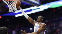 Thunder guard Jalen Williams (8) scores against the Philadelphia 76ers during the third quarter at Xfinity Mobile Arena