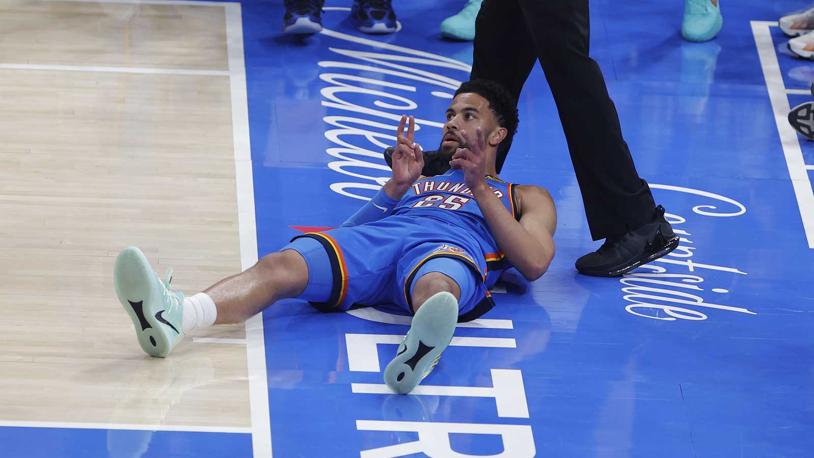 Thunder guard Ajay Mitchell (25) gestures after scoring against the Boston Celtics and falling to the court during the first quarter at Paycom Center