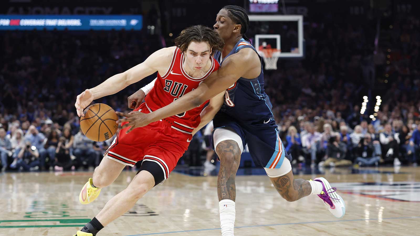 Thunder guard Jalen Williams (8) knocks the ball loose as Chicago Bulls guard Josh Giddey (3) drives down the court during the second half at Paycom Center