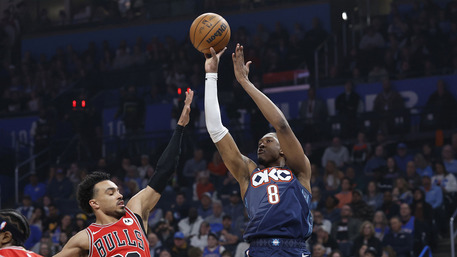 Thunder guard Jalen Williams (8) shoots as Chicago Bulls guard Tre Jones (30) defends during the first quarter at Paycom Center
