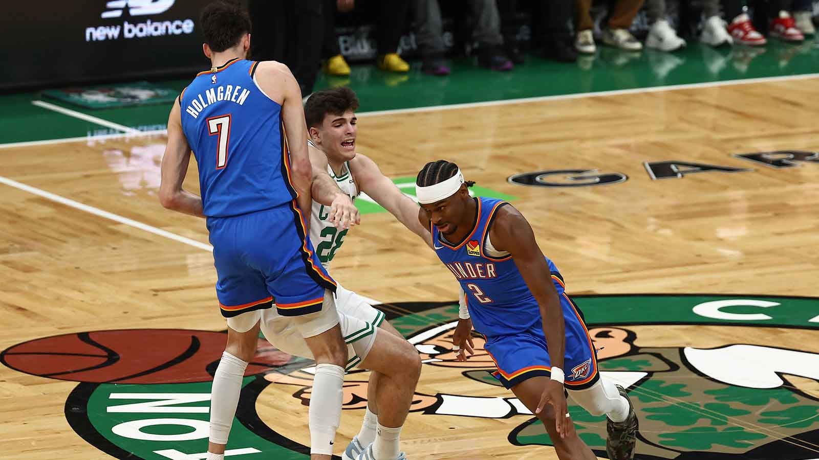Thunder center Chet Holmgren (7) sets a pick on Boston Celtics guard Hugo Gonzalez (28) for guard Shai Gilgeous-Alexander (2) to go around him during the first quarter at TD Garden
