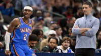 Thunder guard Shai Gilgeous-Alexander (2) and head coach Mark Daigneault look on during the second quarter against the Denver Nuggets at the American Airlines Center
