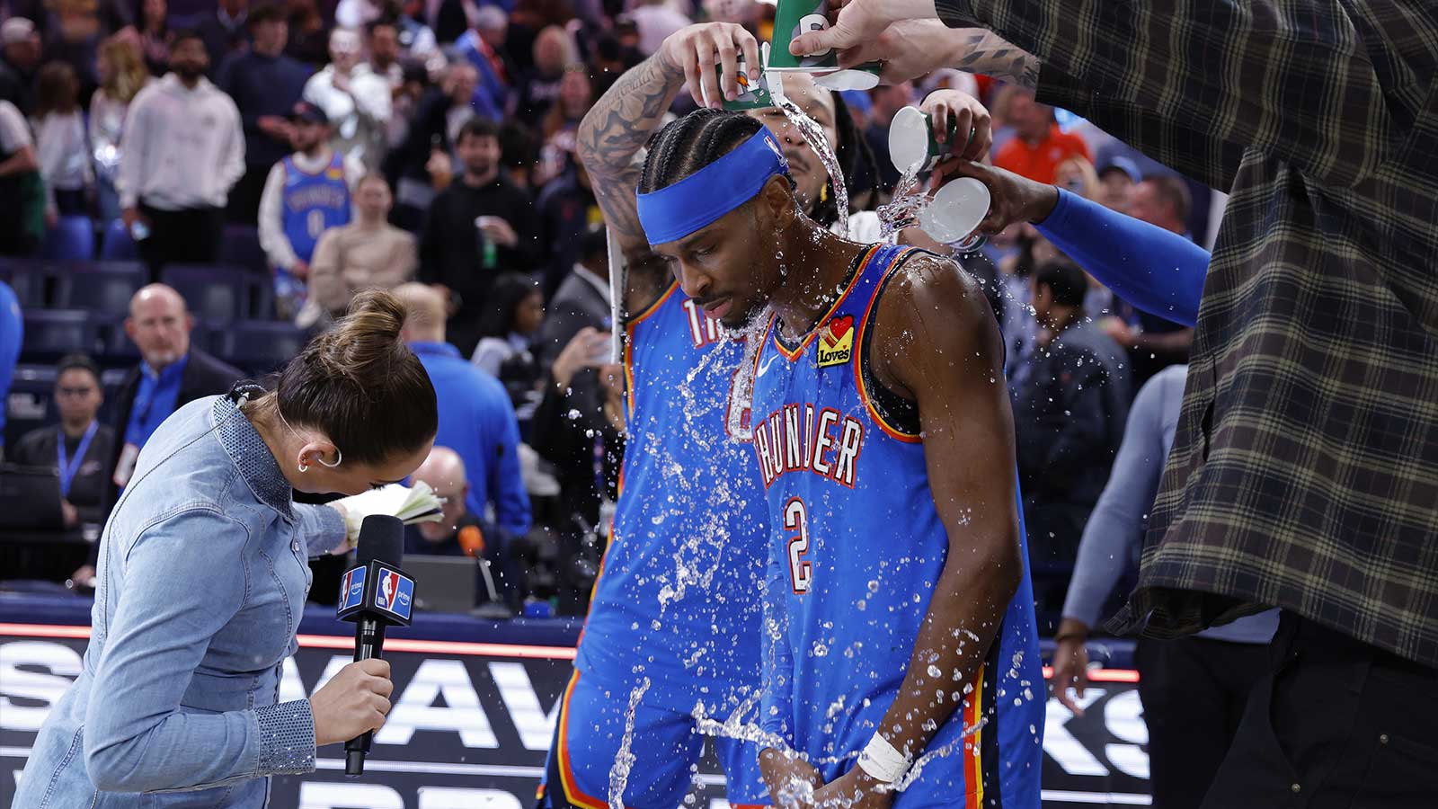 Oklahoma City Thunder guard Shai Gilgeous-Alexander’s teammate pour water on him at the end of a game against the Boston Celtics during the fourth quarter at Paycom Center.