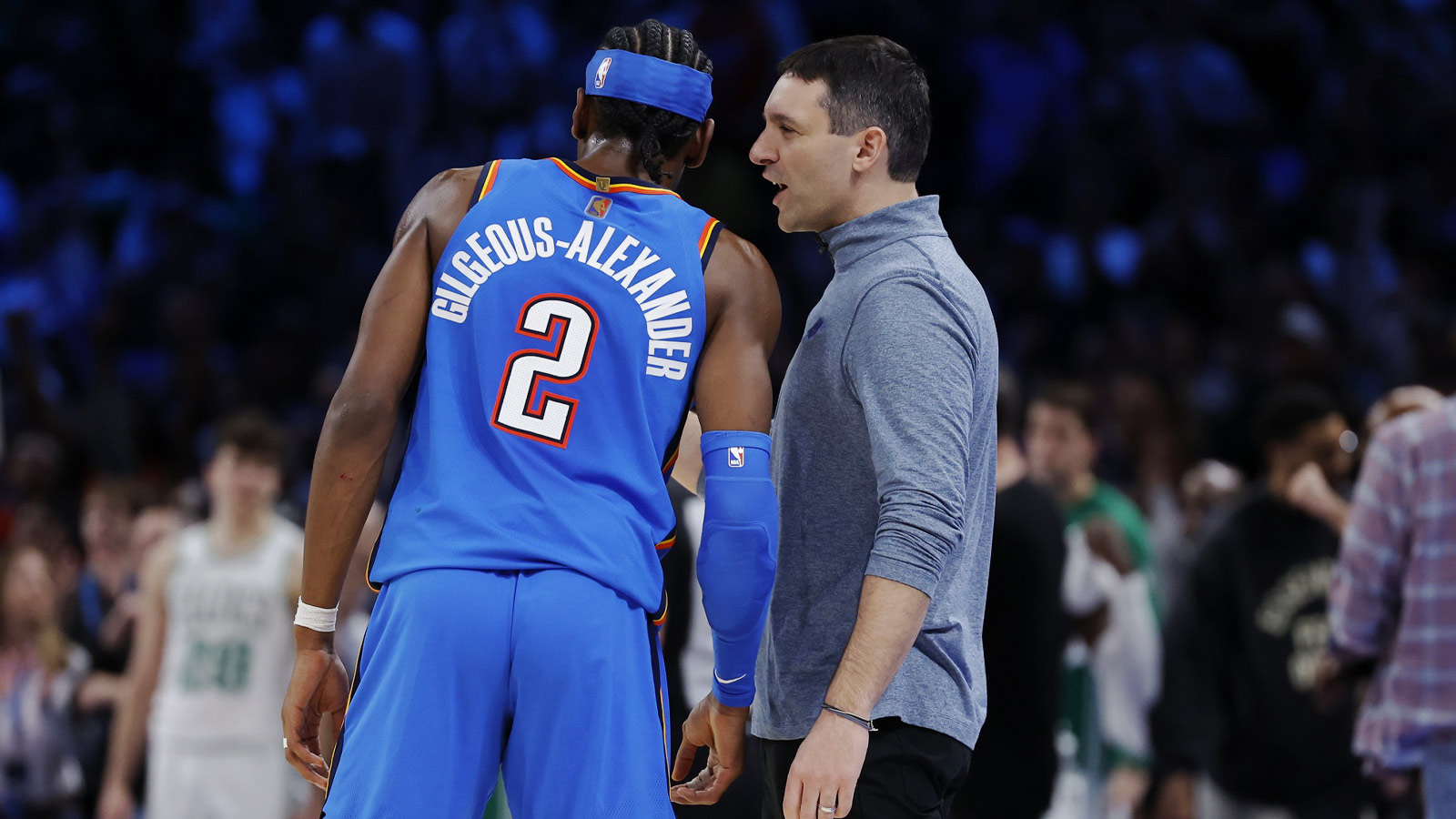 Thunder Head Coach Mark Daigneault talks to guard Shai Gilgeous-Alexander (2) between plays against the Boston Celtics during the fourth quarter at Paycom Center