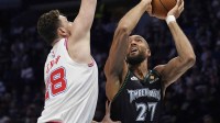 Minnesota Timberwolves center Rudy Gobert (27) shoots against Houston Rockets center Alperen Sengun (28) in the first quarter at Target Center.