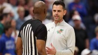 Florida Gators head coach Todd Golden talks to a referee against the Iowa Hawkeyes in the first half during a second round game of the men's 2026 NCAA Tournament at Benchmark International Arena.