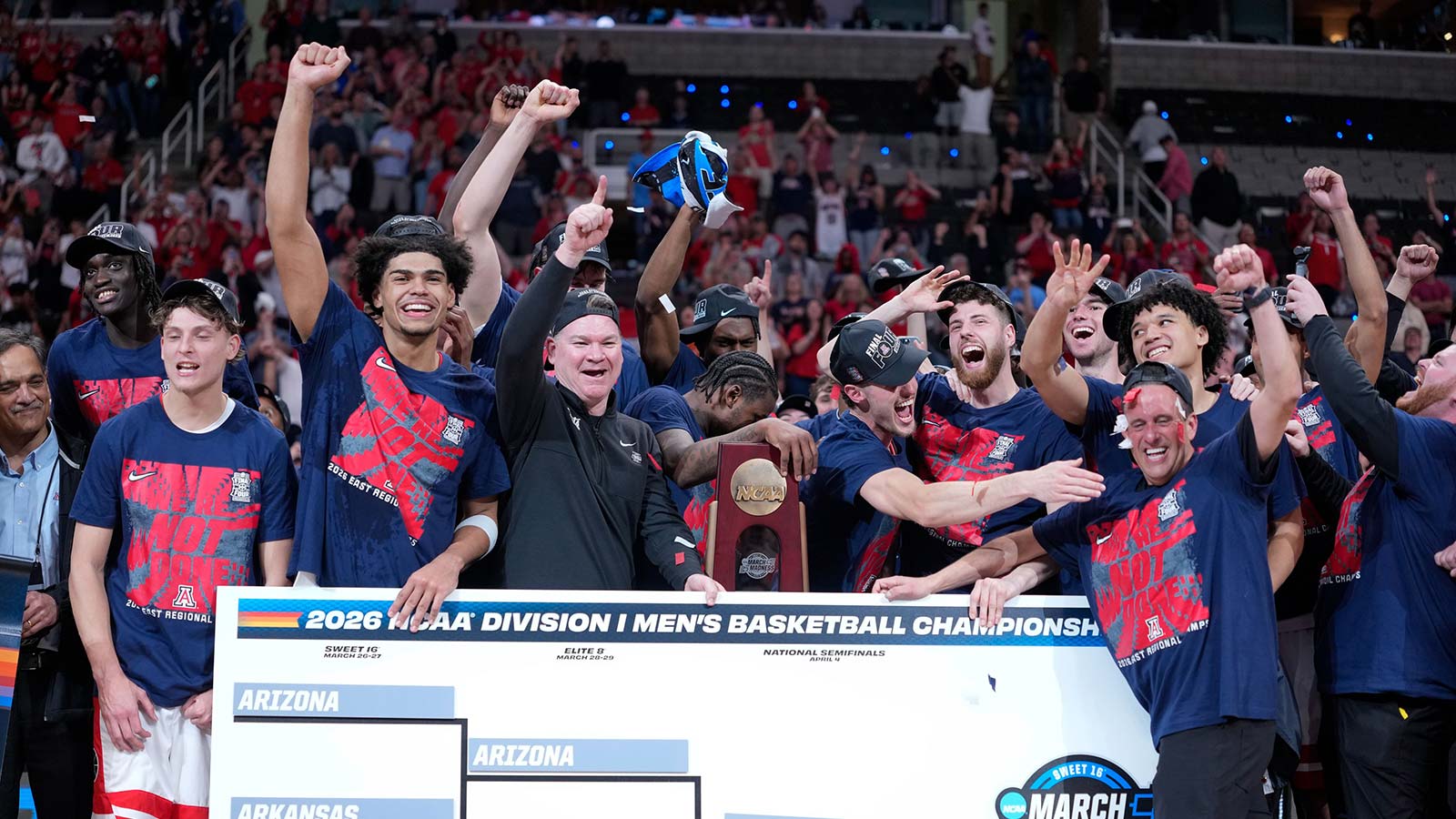 The Arizona Wildcats celebrate with the West Regional Championship trophy after an Elite Eight game against the Purdue Boilermakers of the West Regional of the men's 2026 NCAA Tournament at SAP Center.