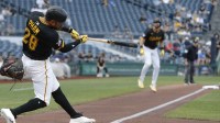 Pittsburgh Pirates left fielder Tommy Pham (28) hits a two run double against the Los Angeles Dodgers during the first inning at PNC Park.