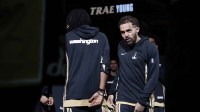 Washington Wizards guard Trae Young (R) is introduced prior to his first appearance as a Wizard against the Utah Jazz at Capital One Arena.