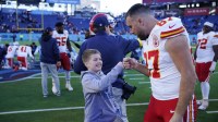 Kansas City Chiefs tight end Travis Kelce (87) greets Joey Borgonzi, 10, after their game at Nissan Stadium Sunday, Dec. 21, 2025. The Titans beat the Chiefs 26-9.
