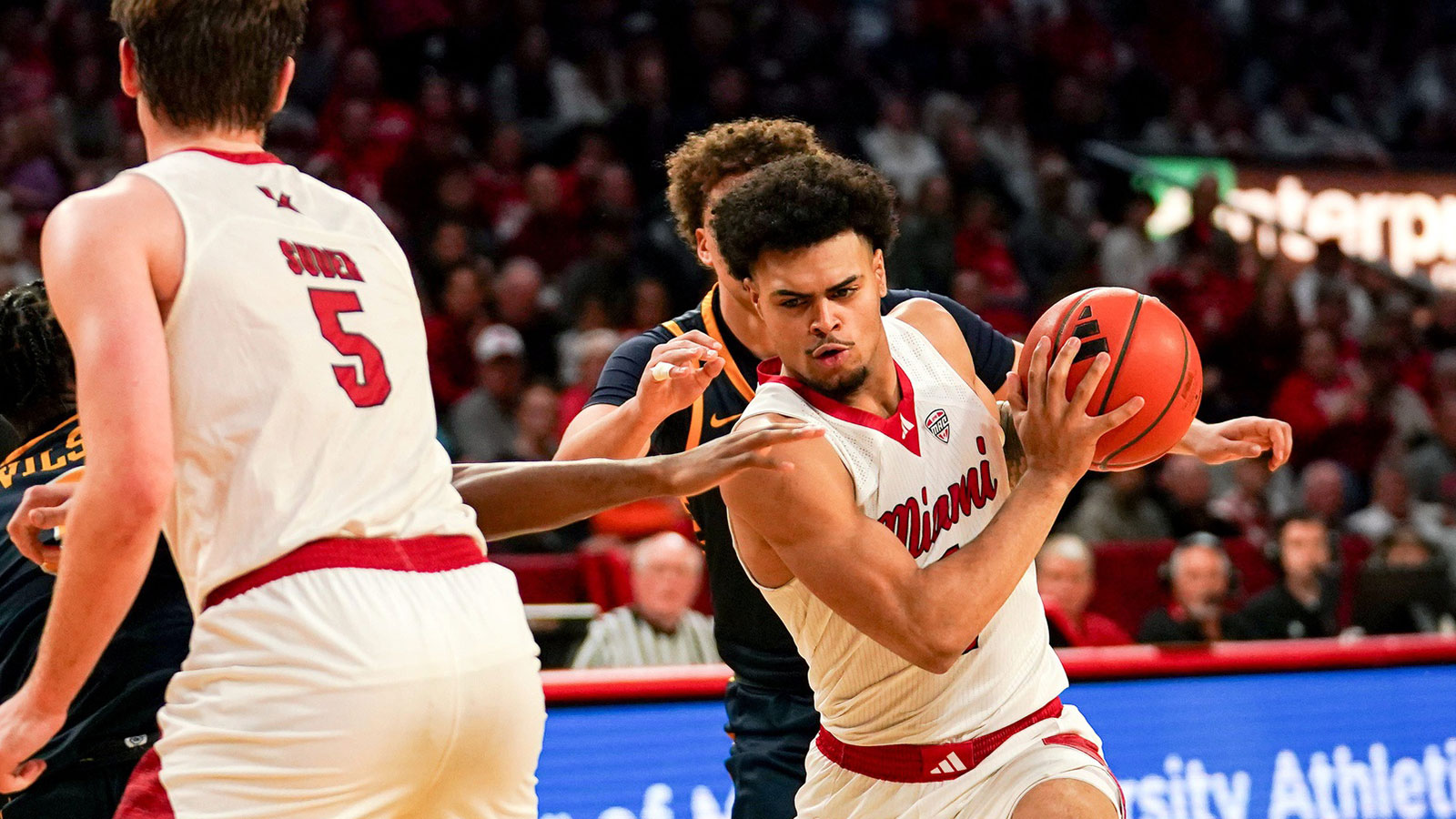 Miami (OH) RedHawks guard Trey Perry (1) handles the ball in the second half of a NCAA men’s basketball game between the Miami Redhawks and Toledo Rockets, Tuesday, March 3, 2026, at Millett Hall in Oxford, Oh. Redhawks won 74-72.