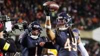 Chicago Bears linebacker Tremaine Edmunds (49) poses for a television camera with cornerback Jaylon Johnson (1) after recovering a fumble against the Green Bay Packers during the third quarter at Soldier Field.