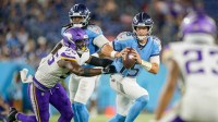 Minnesota Vikings linebacker Austin Keys (56) sacks Tennessee Titans quarterback Trevor Siemian (15) during the fourth quarter of an NFL pre-season game at Nissan Stadium in Nashville, Tenn., Friday, Aug. 22, 2025.