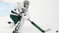 Michigan State goaltender Trey Augustine (1) hits the puck away against Michigan during the second period of Duel in the D at Little Caesars Arena in Detroit on Saturday, February 7, 2026.