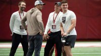 Quarterback Ty Simpson smiles as he gets ready to throw during Pro Day in the Hank Crisp Indoor Practice Facility at the University of Alabama.
