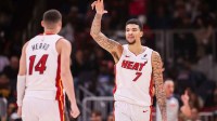 Miami Heat center Kel'el Ware (7) celebrates with guard Tyler Herro (14) after a basket against the Atlanta Hawks in the fourth quarter at State Farm Arena.