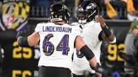 Baltimore Ravens center Tyler Linderbaum (64) and Baltimore Ravens quarterback Lamar Jackson (8) react before the game at Acrisure Stadium.
