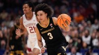 Vanderbilt guard Tyler Tanner (3) brings the ball up the court during the first half of the SEC tournament championship game against Arkansas at Bridgestone Arena in Nashville, Tenn., Sunday, March 15, 2026.
