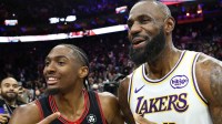 Los Angeles Lakers forward Lebron James (23) and Philadelphia 76ers guard Tyrese Maxey after the game at Xfinity Mobile Arena.
