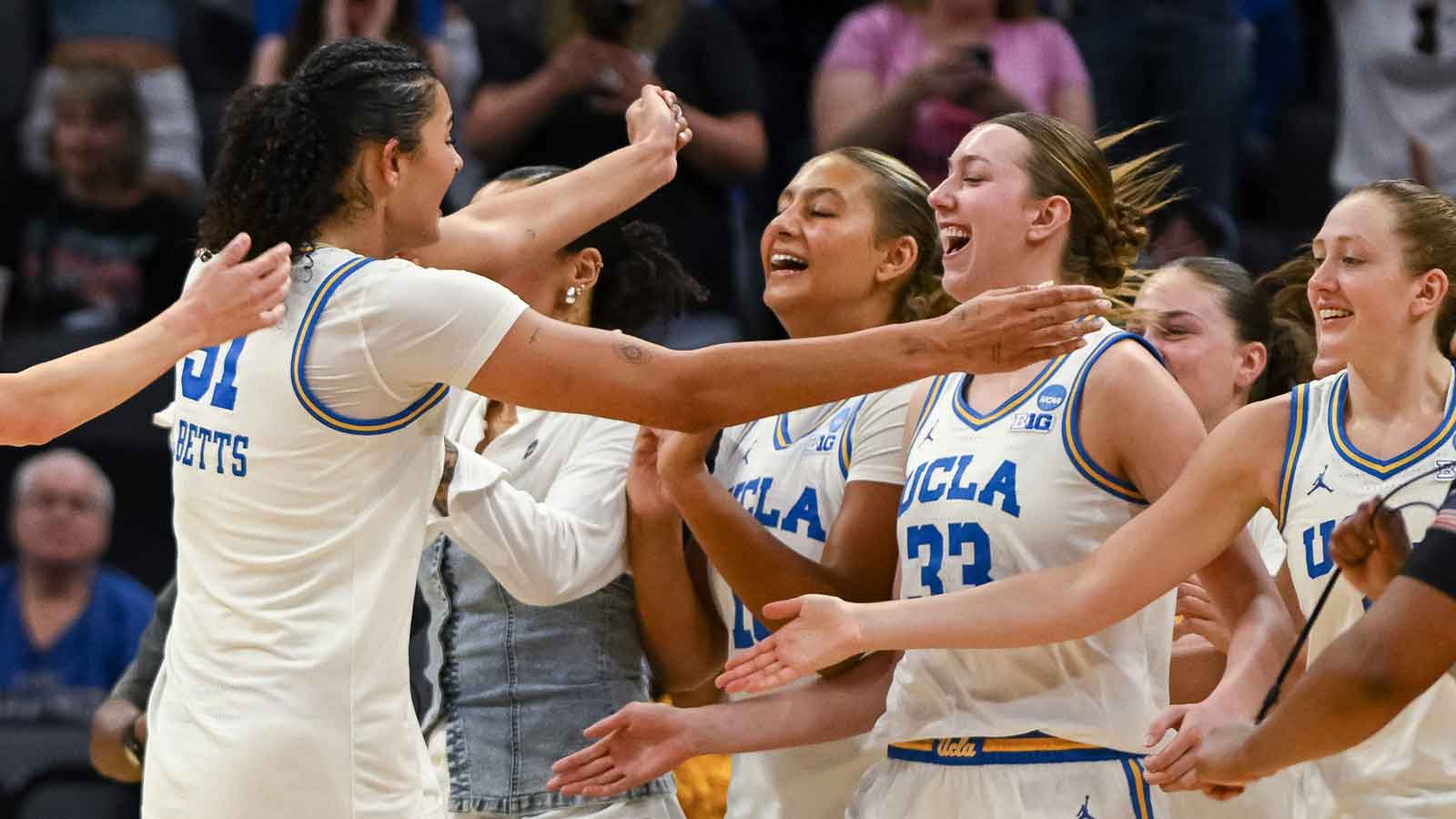 UCLA Bruins center Lauren Betts (51) celebrates with forward Angela Dugalić (32) after defeating the Duke Blue Devils in an Elite Eight game in the Sacramento Regional 4 of the women's 2026 NCAA Tournament at the Golden 1 Center.