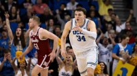 UCLA Bruins forward Tyler Bilodeau (34) points to teammates after hitting a 3-point jumpshot during the second half at Pauley Pavilion presented by Wescom Financial.