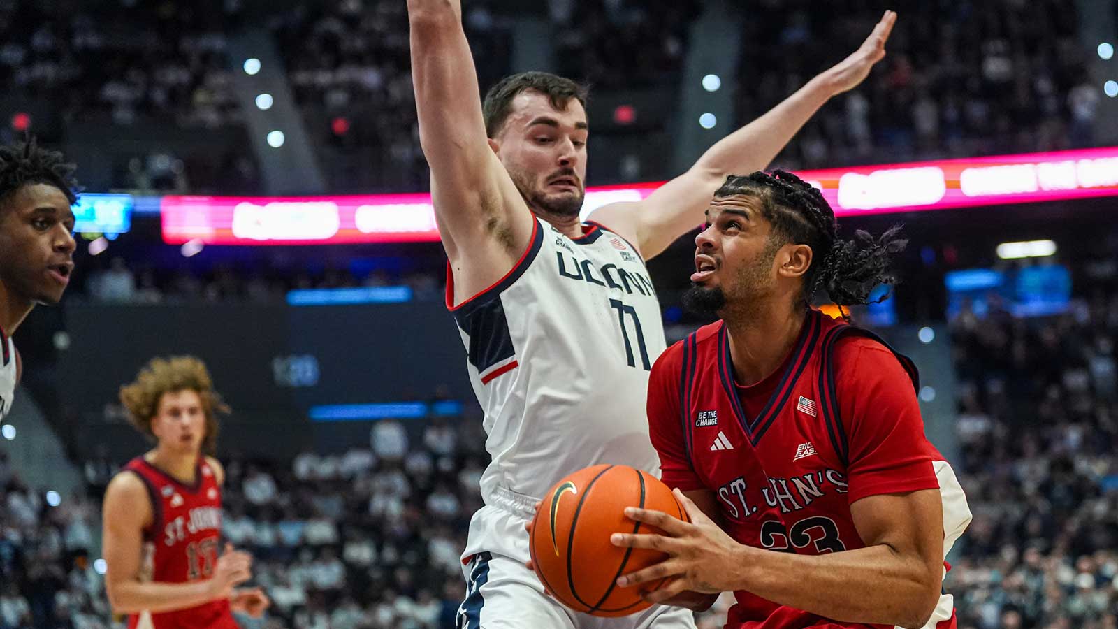 St. John's Red Storm forward Bryce Hopkins (23) drives the ball against UConn Huskies forward Alex Karaban (11) in the second half at PeoplesBank Arena.