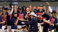 UConn Huskies head coach Geno Auriemma dances with his team after the UConn Huskies are awarded the Fort Worth Regional trophy following their win against the Notre Dame Fighting Irish at Dickies Arena.