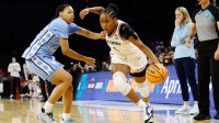 UConn Huskies guard Blanca Quinonez (4) drives past North Carolina Tar Heels guard Nyla Brooks (7) during the first half at Dickies Arena.