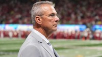 Urban Meyer on the sidelines prior to the 2025 Peach Bowl and semifinal game of the College Football Playoff between the Oregon Ducks and the Indiana Hoosiers at Mercedes-Benz Stadium. Mandatory Credit: Dale Zanine-Imagn Images
